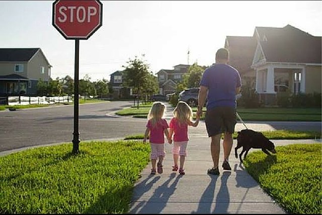 Waterset resident walking with toddlers and dog