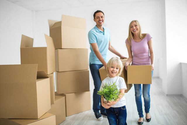 Family with moving boxes.